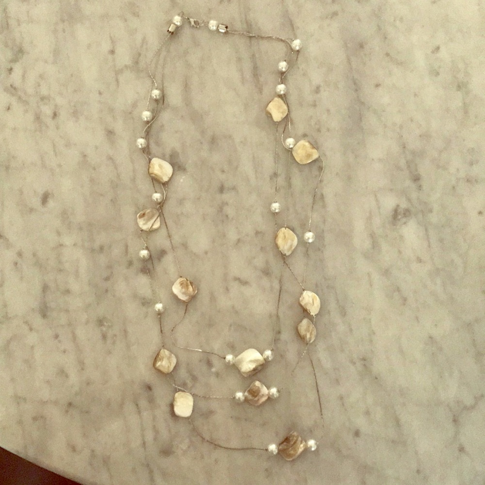 Pearl and shell tri-layered necklace.